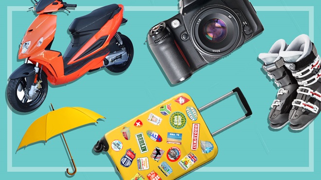 a camera, suitcase, moped, umbrella and ski boots on a teal background